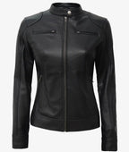 Straight-on front view of the fully zipped black leather jacket showing the stand collar and slim tailored silhouette