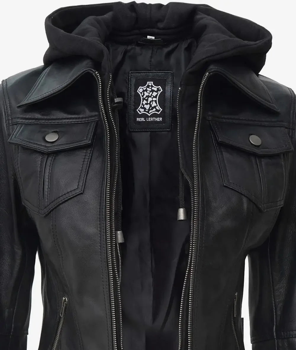 Close up of chest pockets, zip pull and leather patch on collar area with hood visible