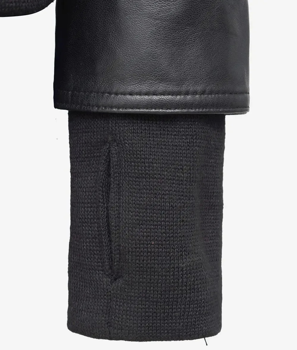 Close up of ribbed knit cuff against the smooth black leather sleeve