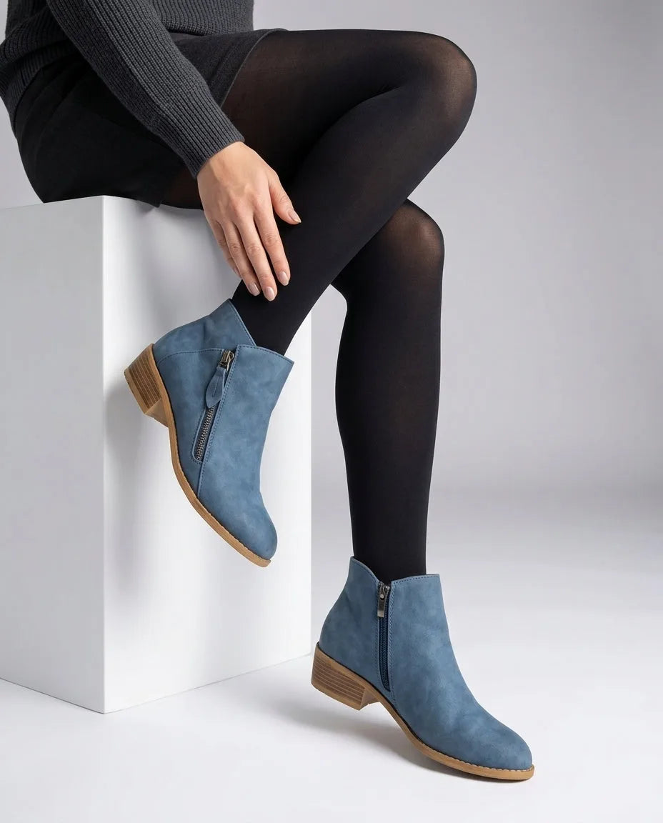 Blue suede-effect ankle boots with side zip and stacked wooden-look heel, worn with black tights