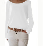 White boat neck jumper with relaxed long sleeves and turned cuffs, shown over white trousers with a tan belt