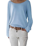 Pale blue boat neck jumper with lightweight drape, long sleeves and folded cuffs, styled with white trousers