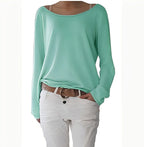 Mint green boat neck jumper with soft flowing fabric and long cuffed sleeves, worn with white trousers