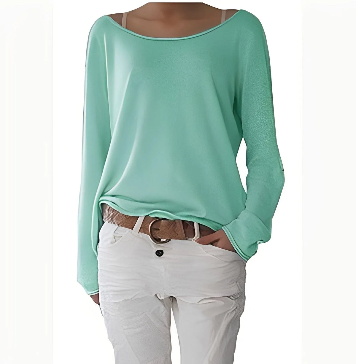 Mint green boat neck jumper with soft flowing fabric and long cuffed sleeves, worn with white trousers