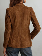 Back view showing the tailored fit and structured shoulders of the brown suede jacket