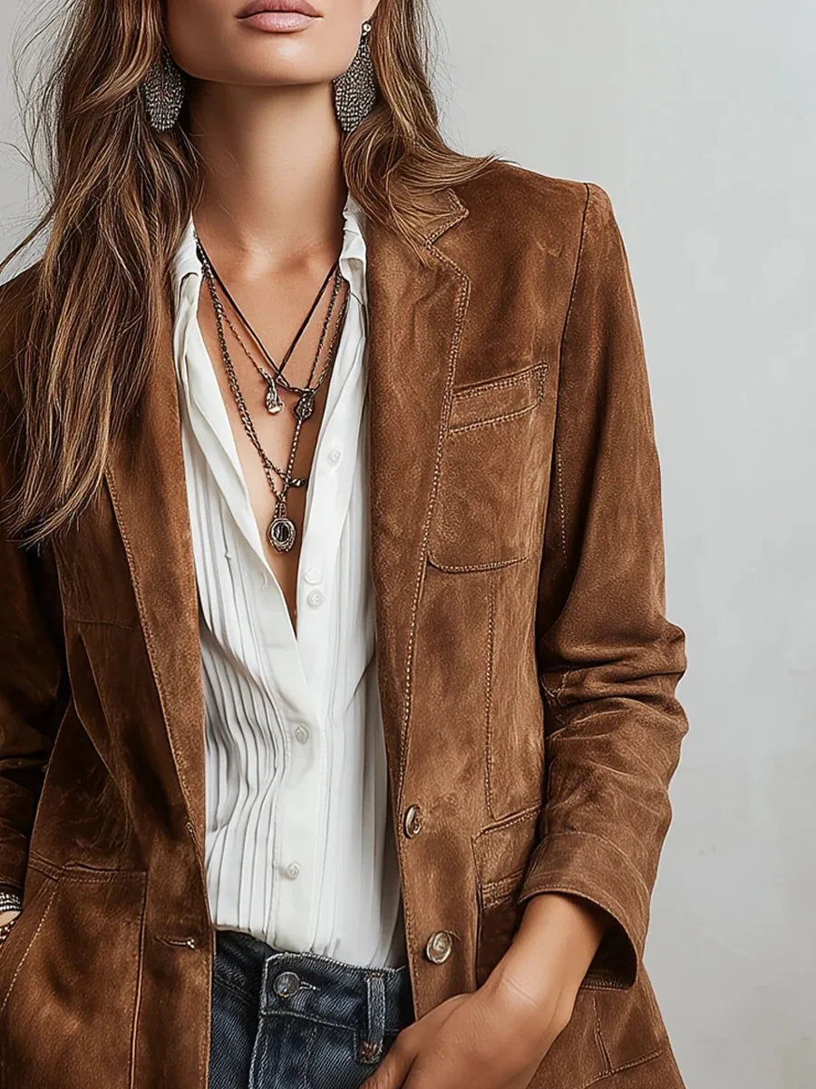 Detail shot highlighting the soft suede texture and visible stitching along the jacket seams