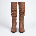 Front view of both boots side by side showing the ruched leather shaft, back zip and round toe shape.