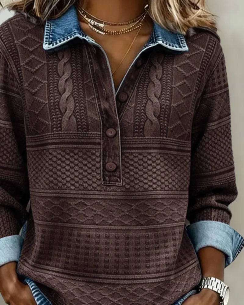 Front view of brown cable knit jumper with folded denim cuffs and layered gold necklaces