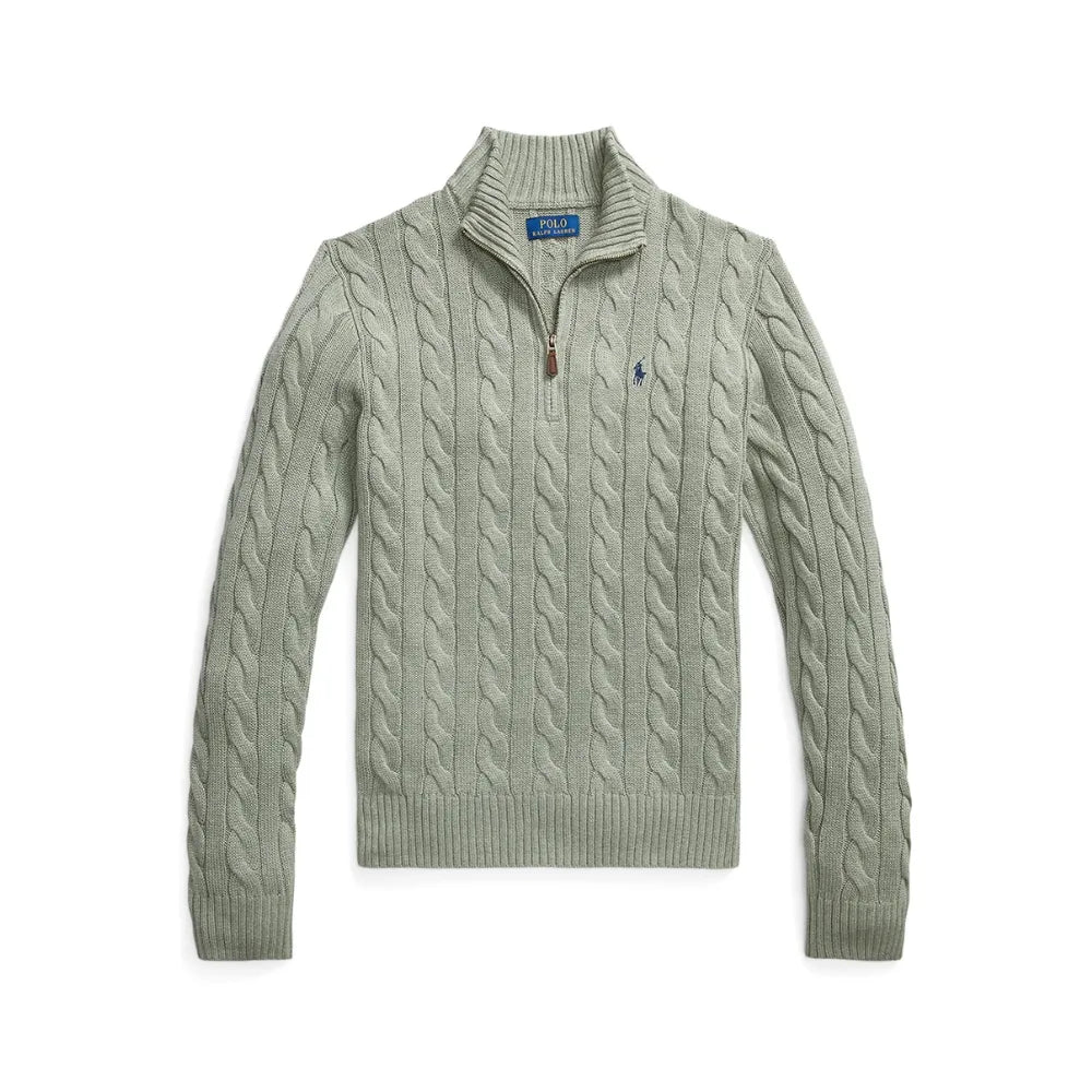 Sage green cable-knit quarter-zip jumper laid flat, showing the ribbed mockneck collar and zip placket detail