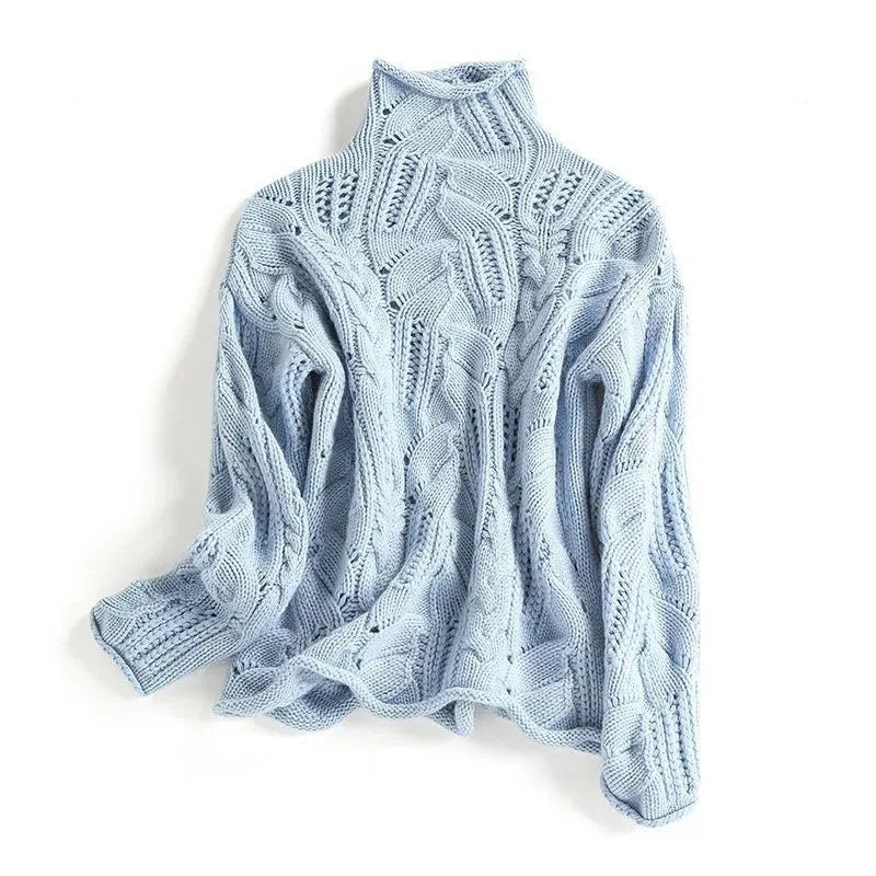 Light blue cable-knit polo neck jumper with textured leaf-pattern stitching, laid flat against a white background