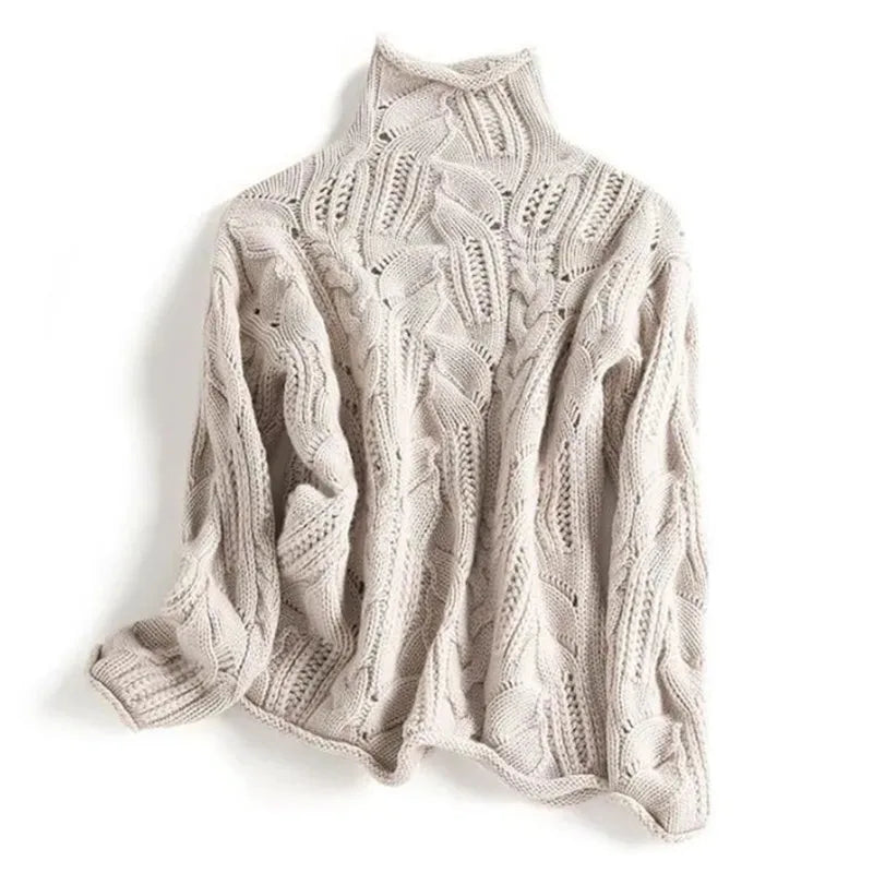 Beige cable-knit polo neck jumper laid flat, showing the same textured leaf and cable stitch pattern