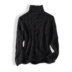 Black cable-knit polo neck jumper laid flat against a white background, showing ribbed collar and cuffs