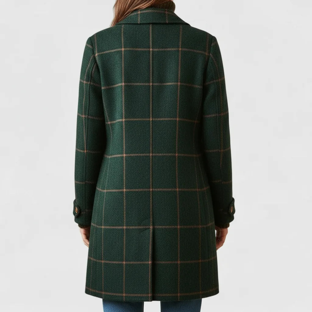 Back view of the green checked coat showing its tailored fit and back seam detailing