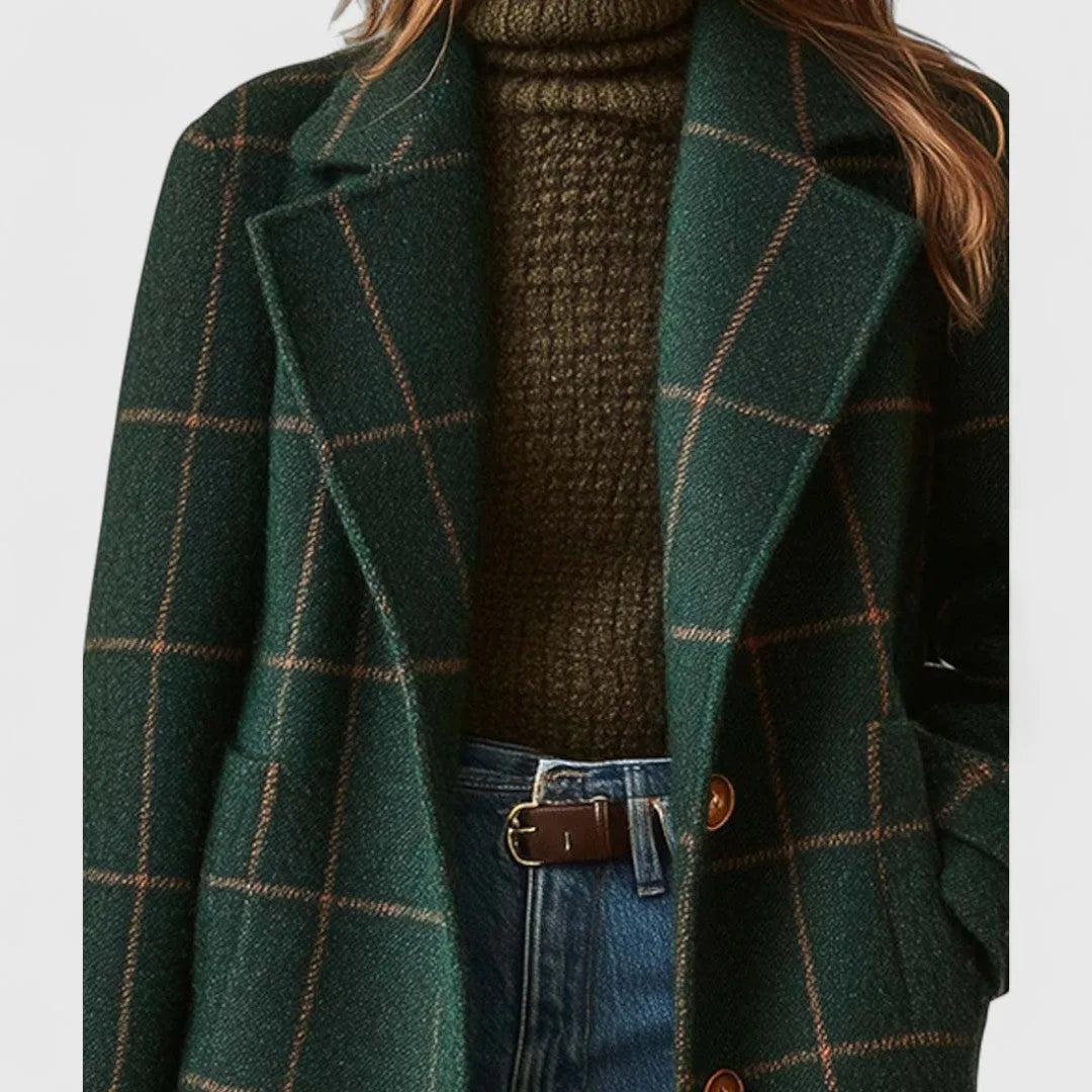 Close-up of the notched lapel and collar on the green tartan-check wool coat