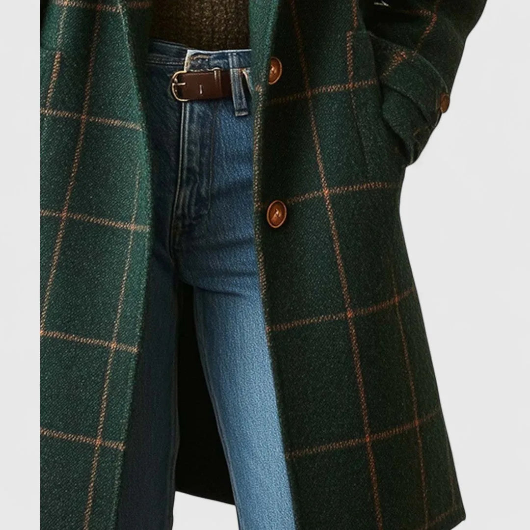 Close-up of tan buttons and checked wool fabric texture on the coat's front closure