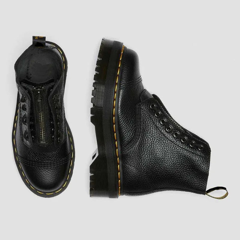 Top-down and side view of the boot pair showing the front zip opening, lace eyelets and chunky grooved sole