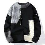 Black colour block jumper with grey cable-knit sleeve and cream diamond knit panel, front view
