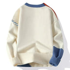 Back view of cream jumper showing blue and orange sleeve panels and ribbed hem