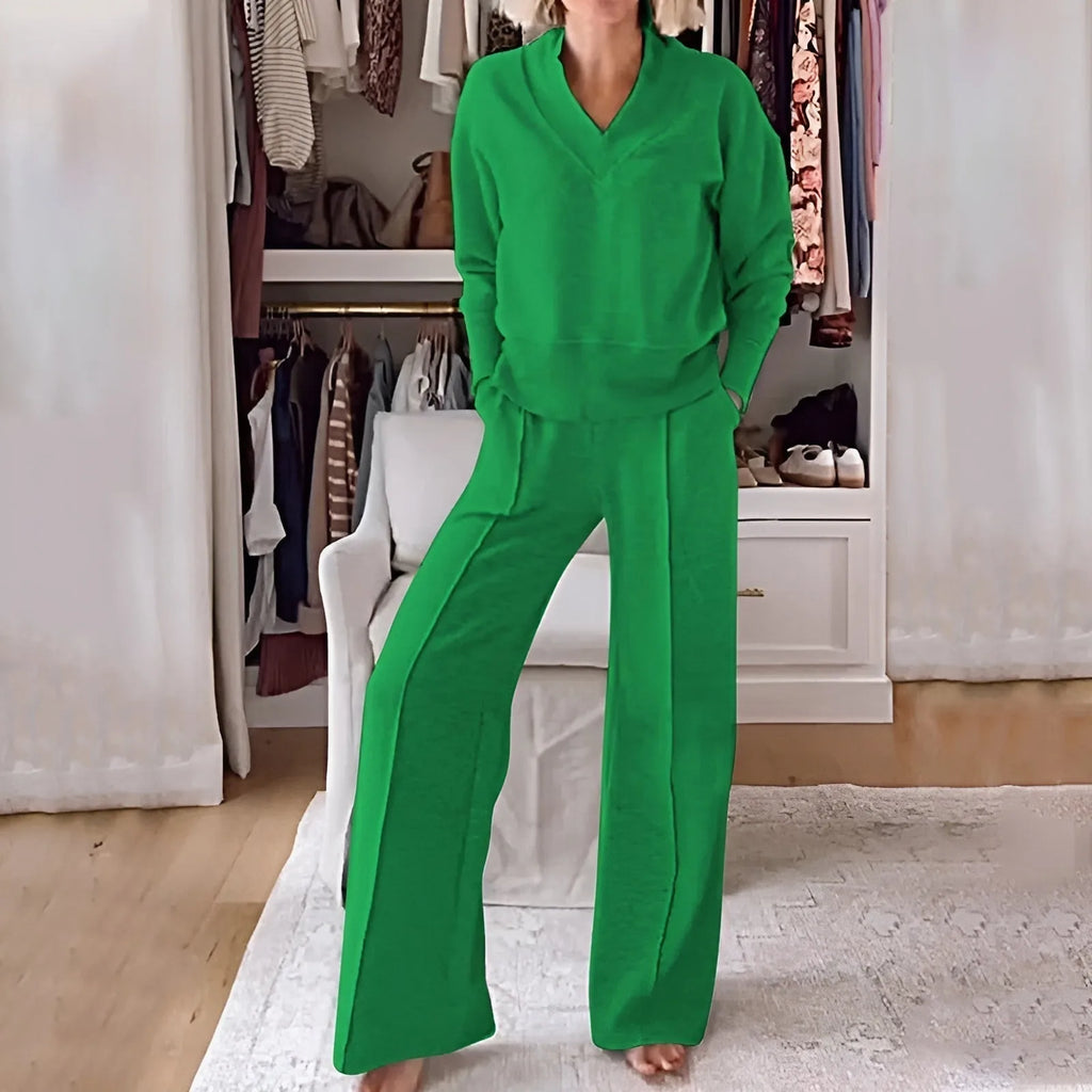 Front view of a woman wearing the set in bright green, showing the loose knit texture in natural light