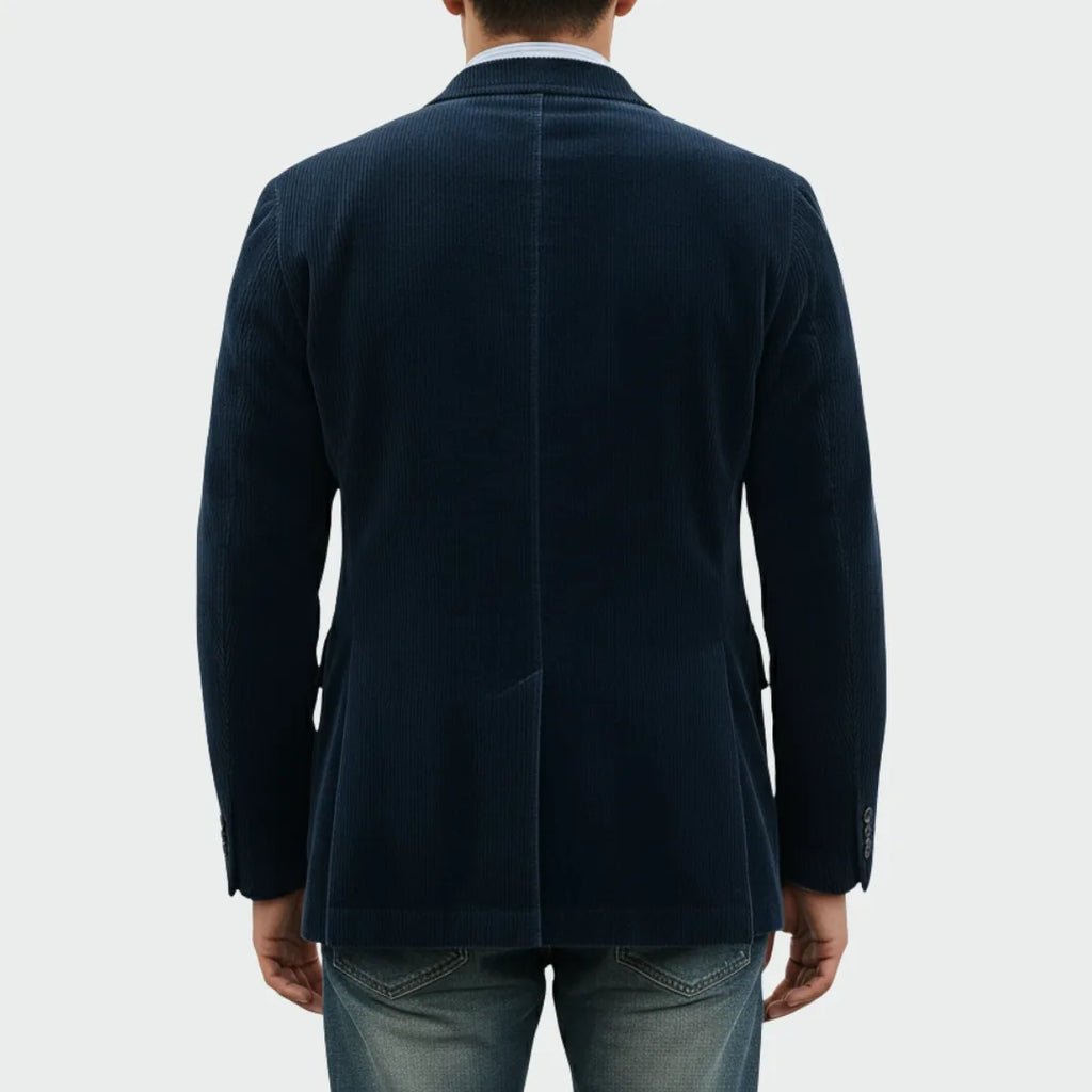Back view of the navy corduroy blazer showing the centre seam and clean tailored fit