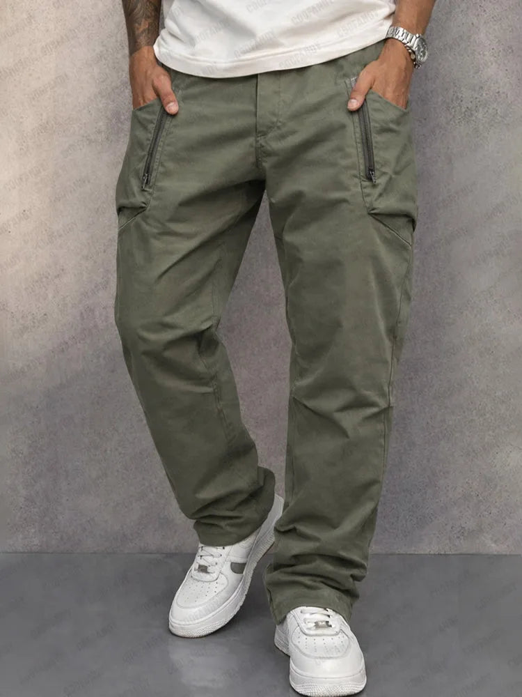 Front view of khaki green cotton cargo trousers with zip pocket detail and relaxed tapered fit