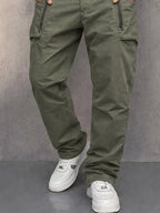 Cropped view of army green cargo trousers showing pocket construction and leg seam detailing