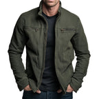 Front view of man wearing an olive green cotton zip jacket with twin chest zip pockets, worn over a navy t-shirt