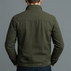 Back view of the olive green zip jacket showing the yoke seam detail and relaxed shoulder fit