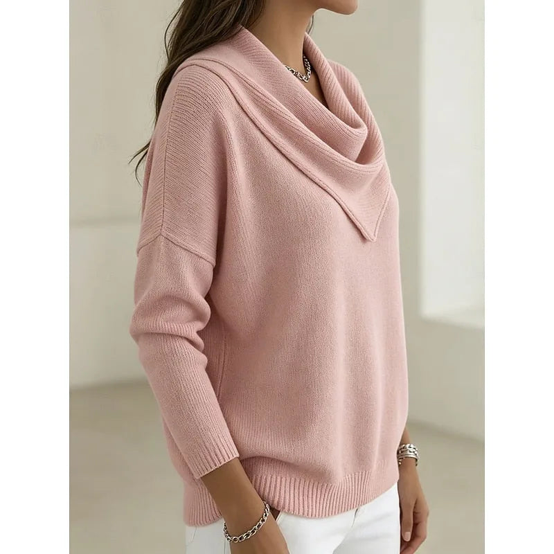 Side profile of the pink cowl-neck jumper highlighting the batwing sleeve and draped collar shape