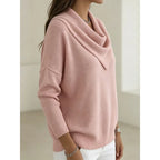 Side profile of the pink cowl-neck jumper highlighting the batwing sleeve and draped collar shape