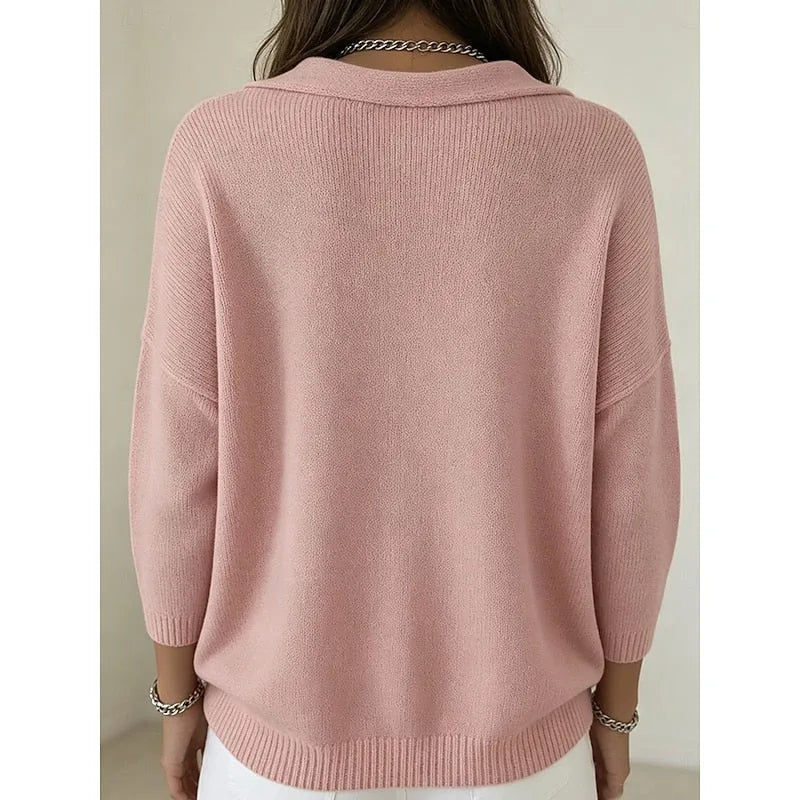 Back view of the pink jumper showing the ribbed hem, dropped shoulders and relaxed silhouette