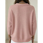 Back view of the pink jumper showing the ribbed hem, dropped shoulders and relaxed silhouette