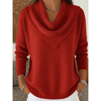 Front view of the jumper in red, showing the draped cowl collar and long sleeves