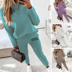 Four colourways of the two-piece loungewear set shown together: sea blue, purple, white and khaki, each with printed leg detail