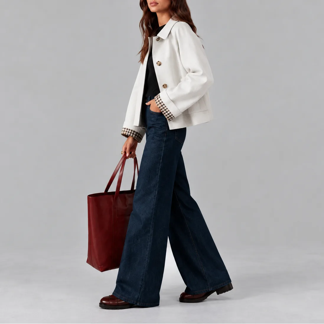 Side profile of the white cropped jacket showing the gingham-checked cuff lining and collar