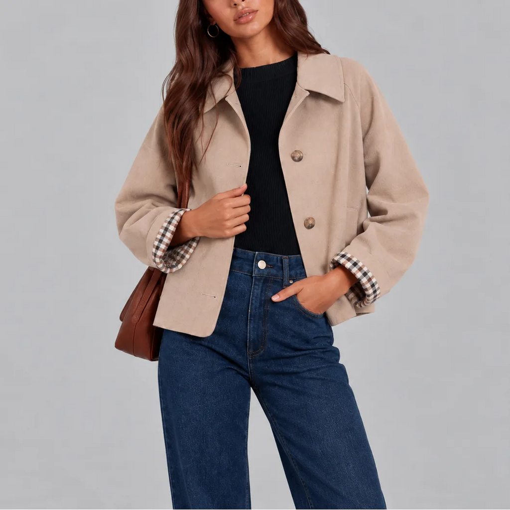 Close-up of a beige cropped trench jacket showing the wool-look texture and button front