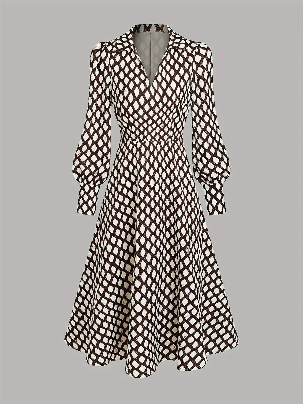 Flat lay of the full dress showing the collared V-neck, long bishop sleeves and swing skirt silhouette