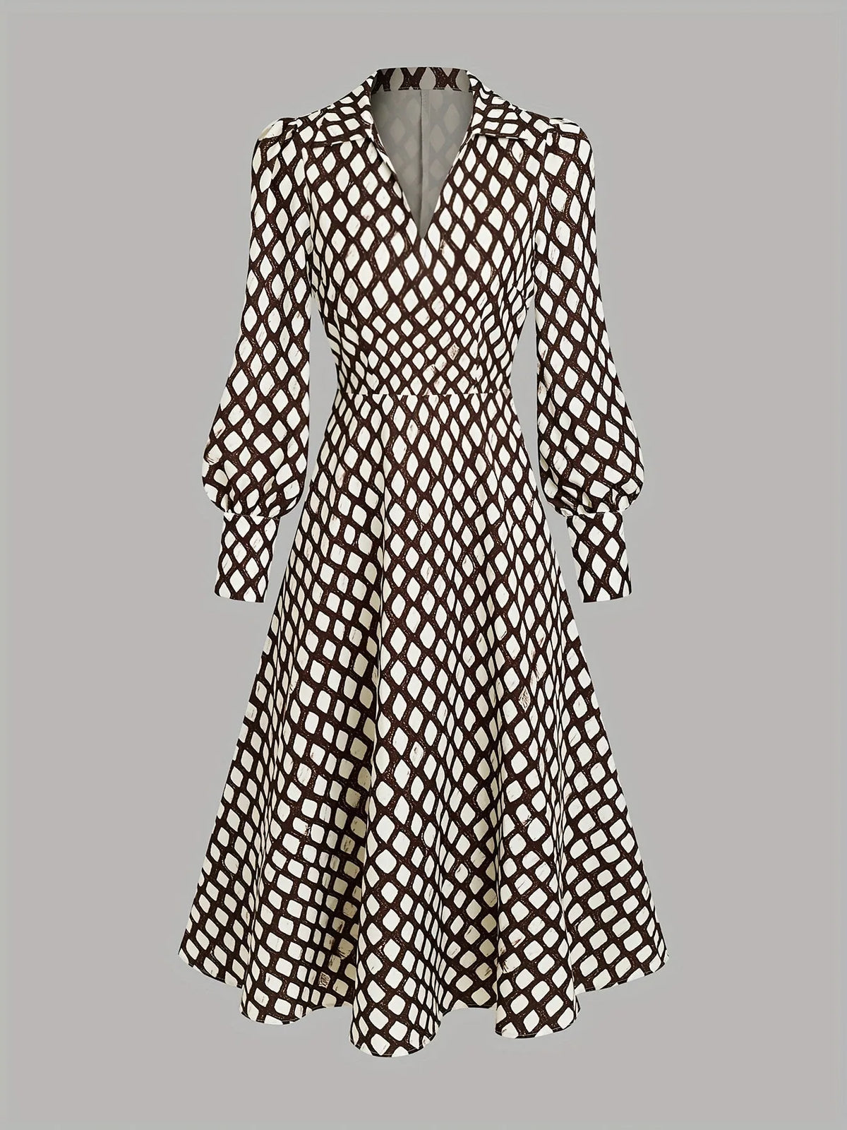 Flat lay of the full dress showing the collared V-neck, long bishop sleeves and swing skirt silhouette