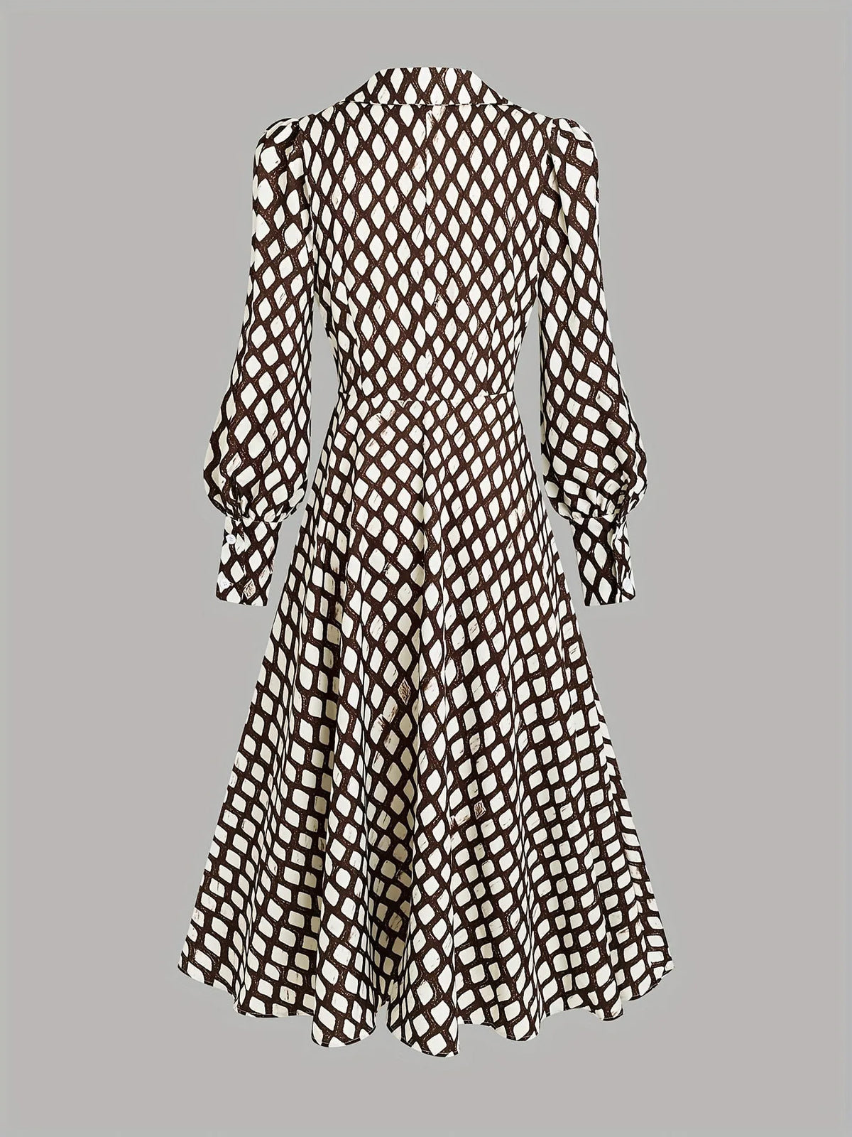 Flat lay back view of the midi dress highlighting the seamed waist and the flowing hemline