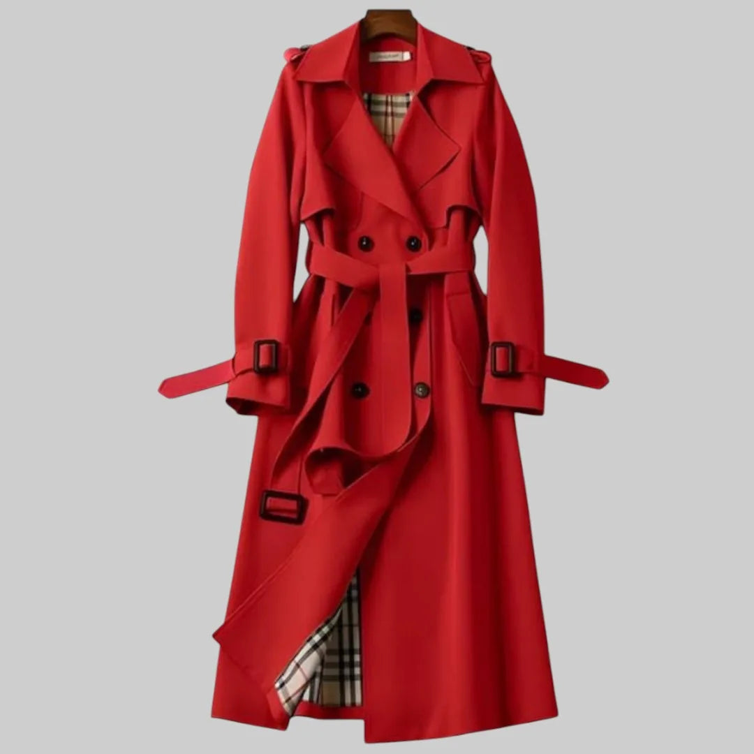 Red trench coat with notched collar, buckled cuffs and self-tie belt, front view on hanger