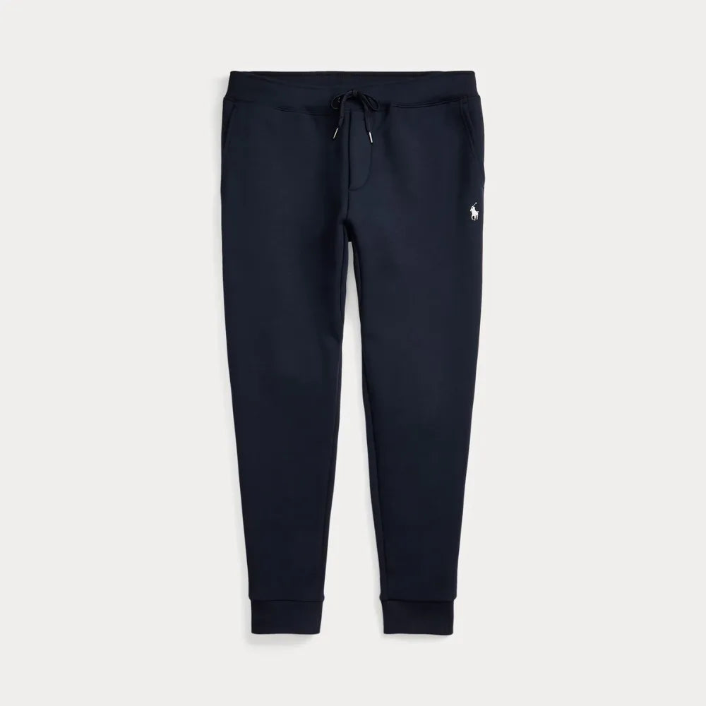 Navy double-knit joggers laid flat, showing drawstring waistband and tapered leg shape