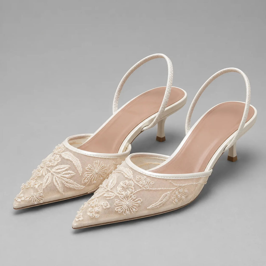 Pair of ivory embroidered mesh kitten heel slingbacks with pointed toe, floral beaded detail and slim strap