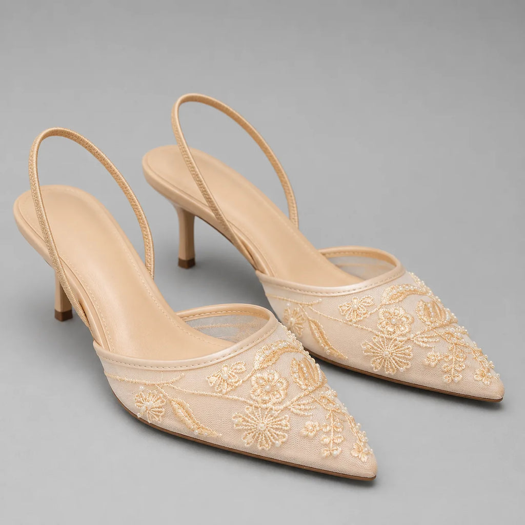 Apricot-toned embroidered mesh kitten heel mules with pointed toe, shown from above at an angle