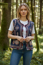 Close-up front view of the quilted gilet highlighting the diamond and floral embroidery patterns on the chest panels.