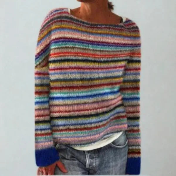 Multicoloured striped jumper in pink, blue, mustard and red tones with a contrasting navy cuff