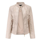 Light beige faux leather jacket with stand collar, press-stud neck fastening and quilted shoulder detail, shown open