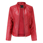 Red faux leather jacket with zip-front closure, quilted shoulder panels and curved hem, displayed against a white background