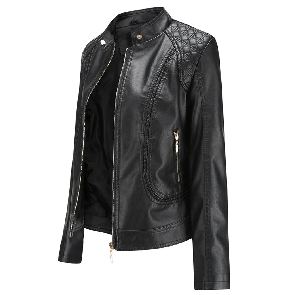 Side angled view of a black faux leather jacket showing the quilted shoulder panel, zip pocket and fitted silhouette