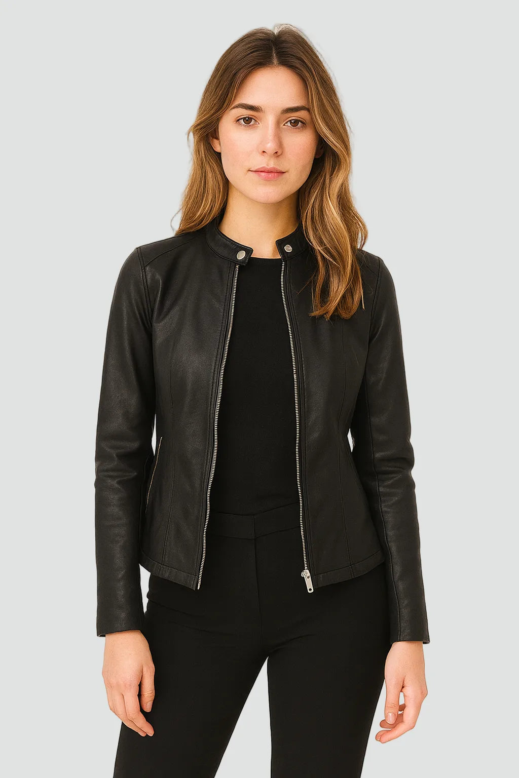 Front view of a black faux leather jacket with stand collar, zip fastening and press-stud tab, worn over a black top