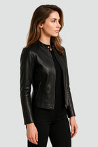 Side profile of the black faux leather jacket showing the fitted waist and zip pocket detail